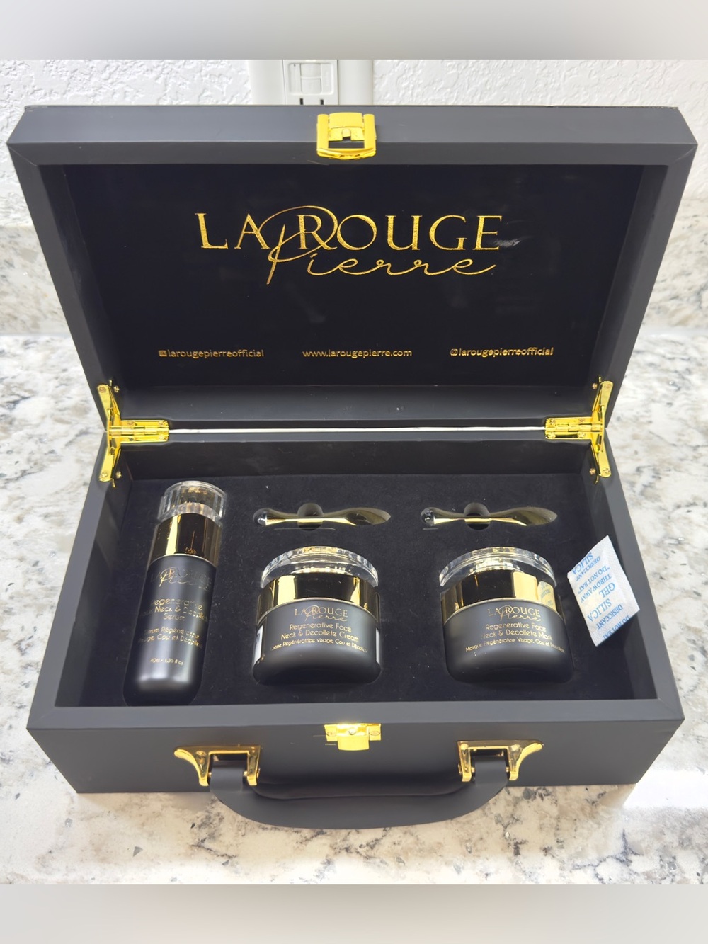 La Rouge Pierre Obsidian Collection Briefcase Skin Care Collection.